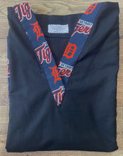 Load image into Gallery viewer, Solid Black Scrub Top with Detroit Tigers Baseball Fabric on *Neck Band & Pocket Options* Medical Scrub Top Unisex Style Shirt for Men & Women