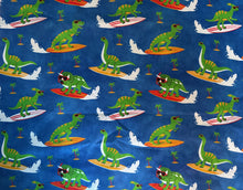 Load image into Gallery viewer, Fun in the Sun Surfing Dinosaurs with Sunglasses Medical Scrub Top Unisex Style for Men & Women