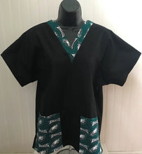 Load image into Gallery viewer, Solid Black Scrub Top with Philadelphia Eagles Football Fabric on *Neck Band & Pocket Options* Medical Scrub Top Unisex Style Shirt for Men & Women