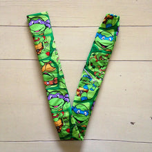 Load image into Gallery viewer, TMNT Teenage Mutant Ninja Turtles Donatello Michaelangelo Raphael Leonardo Faces Green Fabric Stethoscope sock cover for Medical Professionals