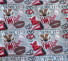 Load image into Gallery viewer, Solid Black Scrub Top with WISCONSIN BADGERS FABRIC on *Neck Band &amp; Pocket Options* Medical Scrub Top Unisex Style Shirt for Men &amp; Women
